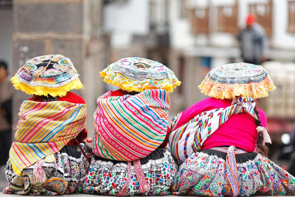 Colorful traditional costumes worn at a festival in Cusco, Peru.